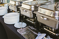 table set with serving pans dishes and cutler table set with serving pans dishes and cutler